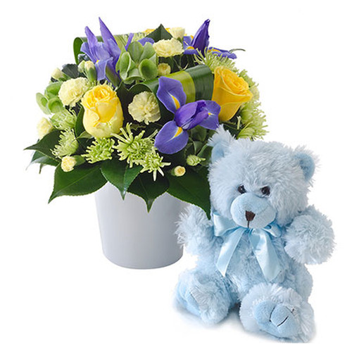 Bright mixed arrangement with a teddy bear