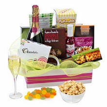 Assortment of sweet gourmet treats topped off with a bottle of quality Australian sparkling wine