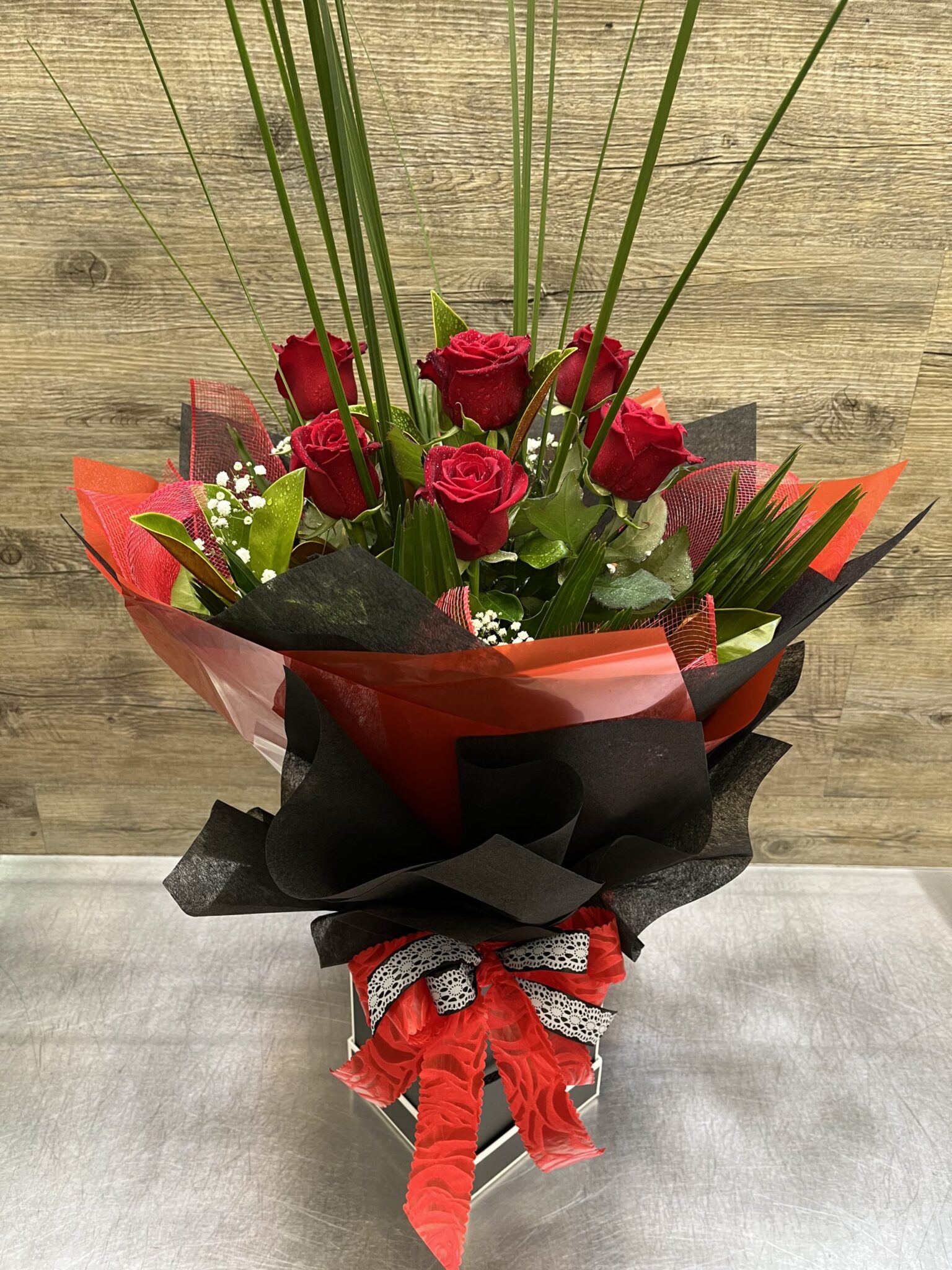 1/2 Doz Long stemmed Red Roses with lush greenery - Lavish Flowers Online