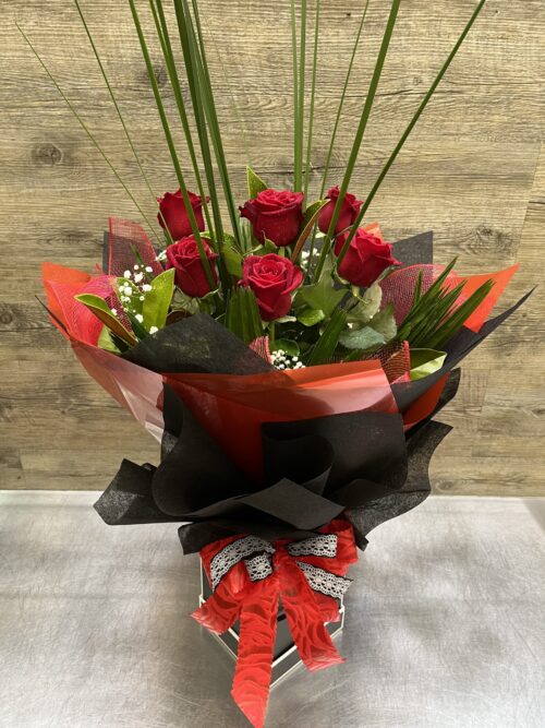 1/2 Doz Long stemmed Red Roses with lush greenery